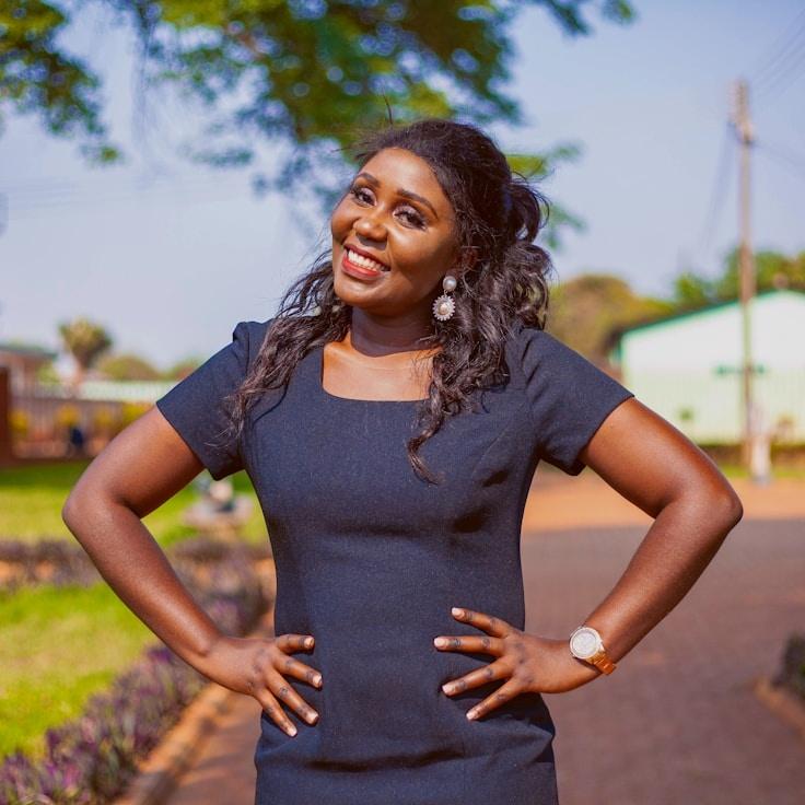 Avery Singh, Lead Design Curator at Harvest Paper Fold, reviewing corporate floral arrangements